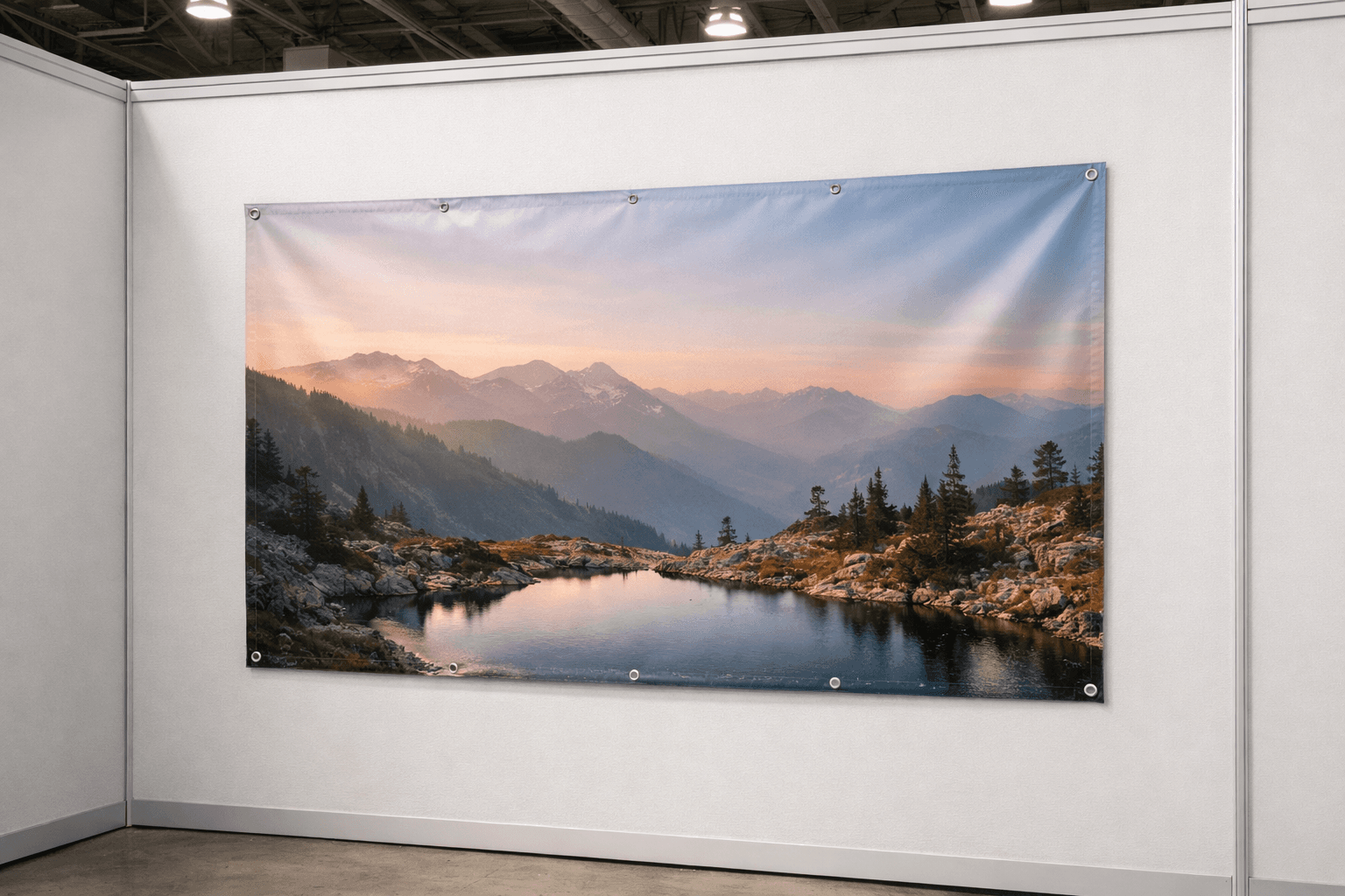 Mid-size vinyl banner displayed on a clean booth wall with even light