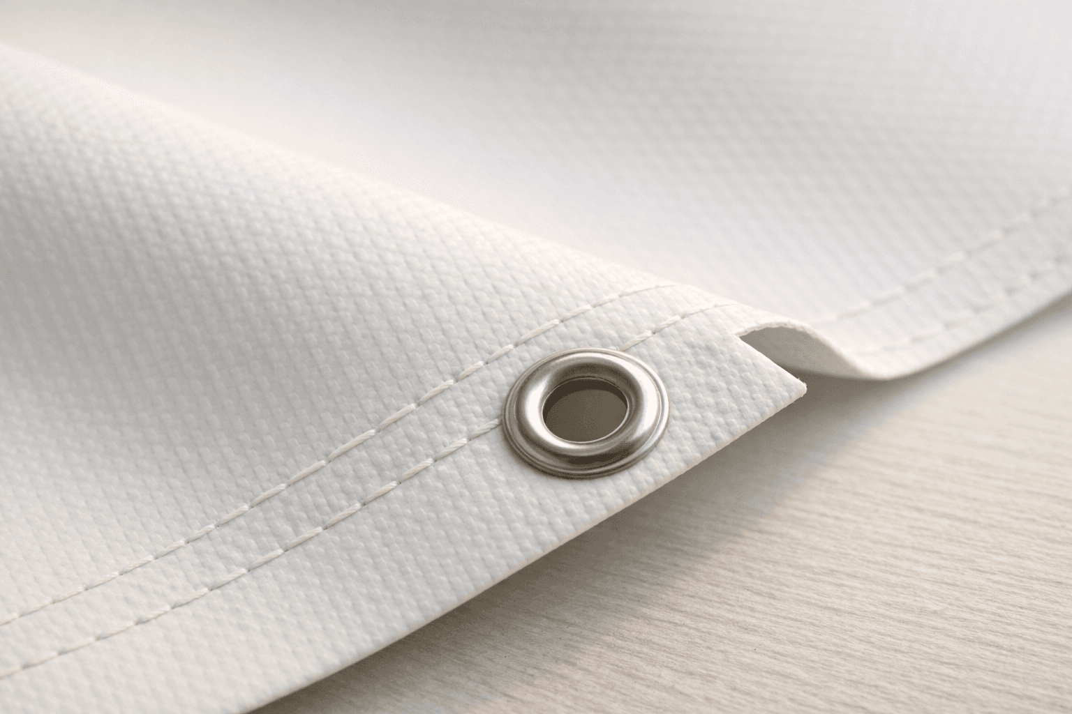 Close-up of banner material texture with soft shadow and edge detail